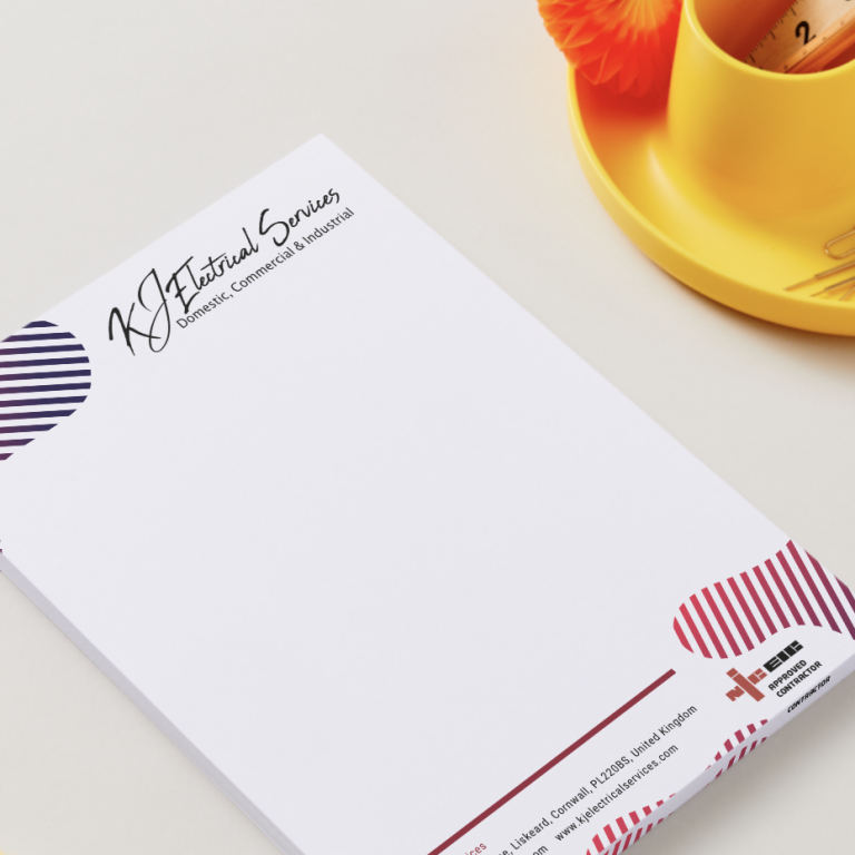 A blank notepad / Letterhead with a decorative header and a cup on a yellow holder.